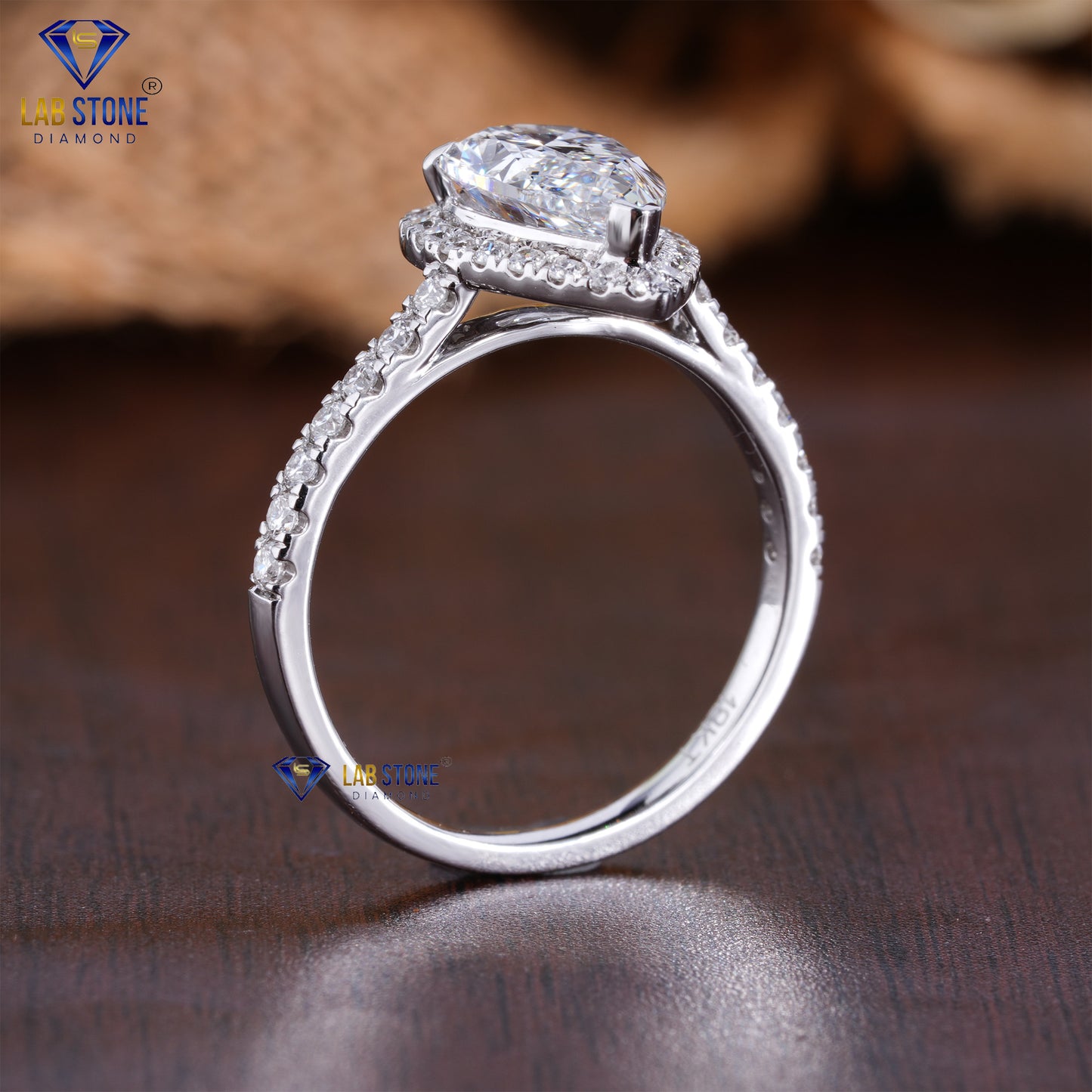 2.75 TDW Round & Pear Cut Women’s Halo Diamond Ring