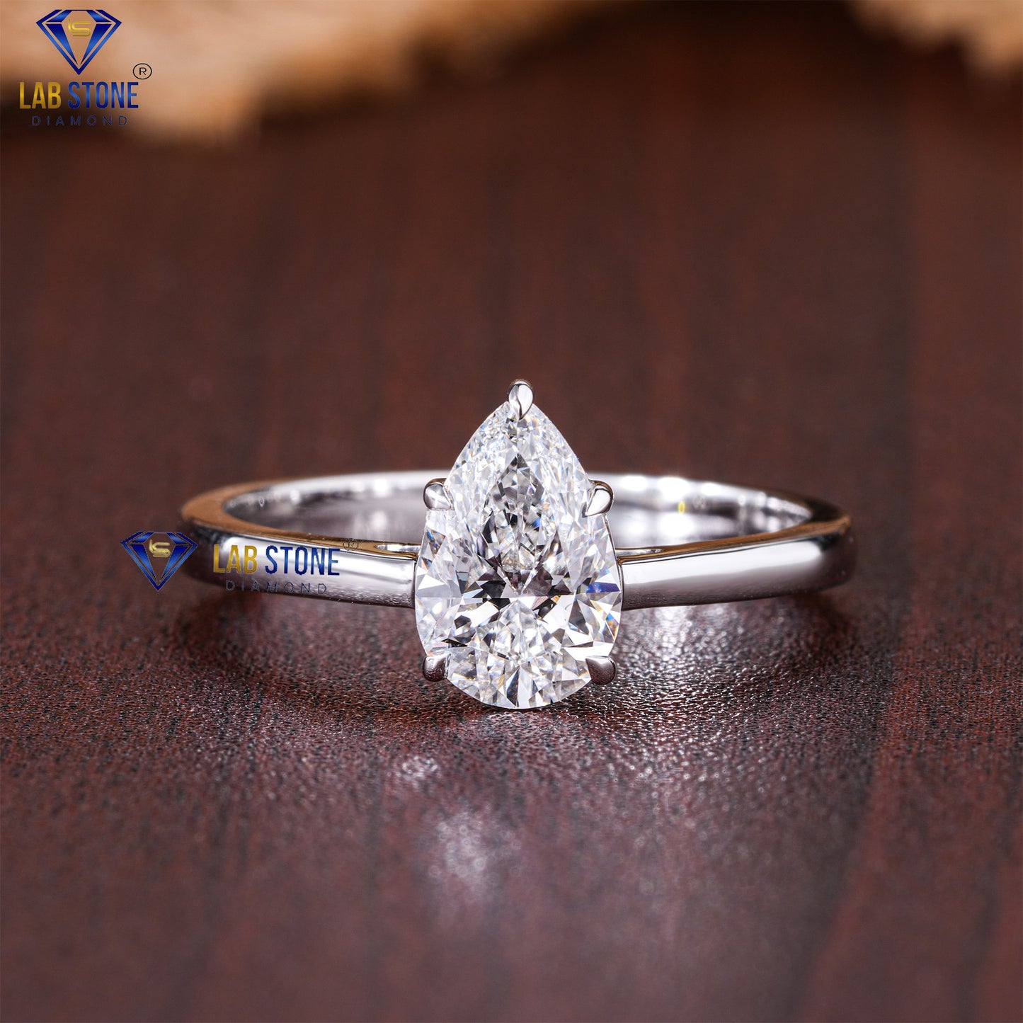 1.50 TDW Pear Cut Diamond Women’s Solitaire Ring