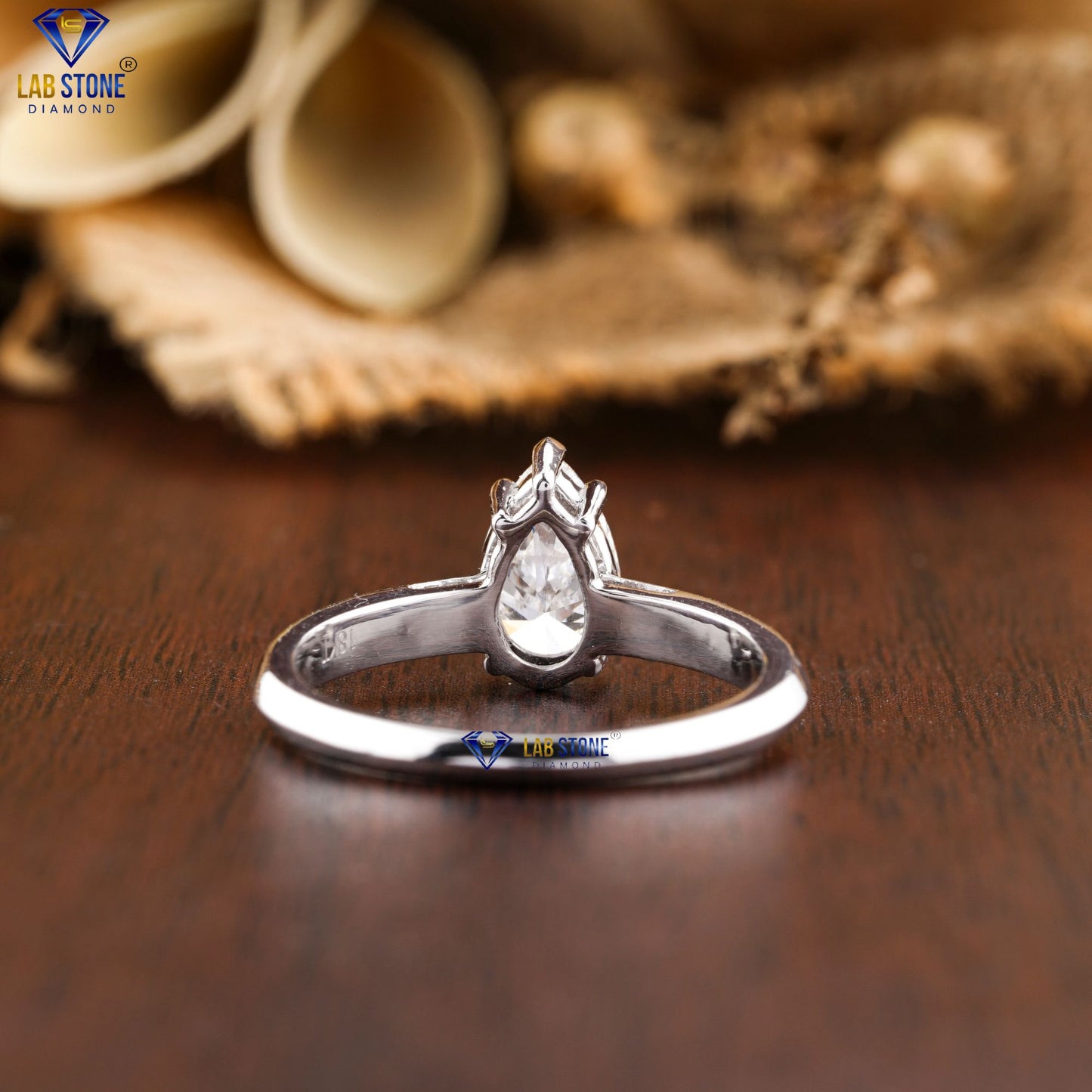 0.97 TDW Pear Cut Women’s Solitaire Diamond Ring