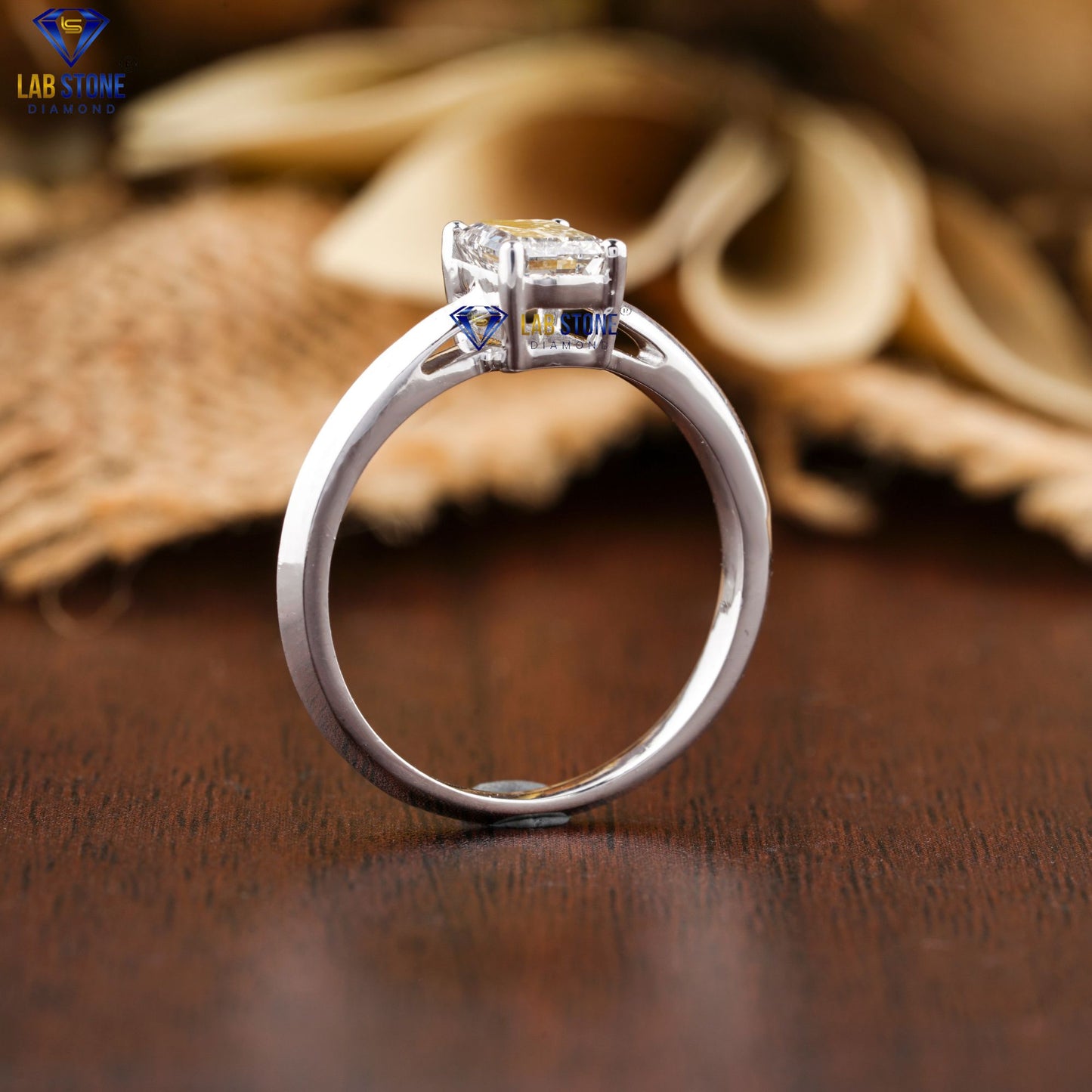 0.85 TDW Emerald Cut Women’s Solitaire Diamond Ring