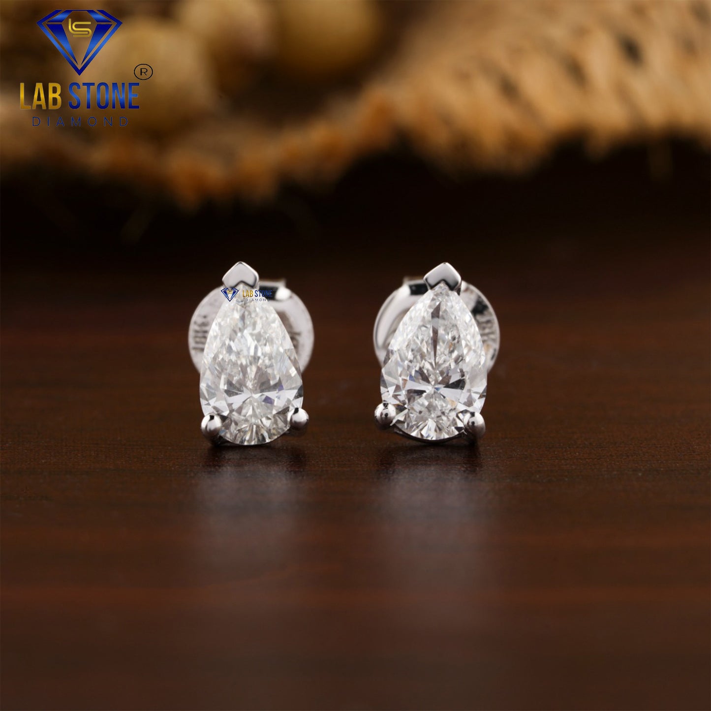0.90 TDW Pear Cut Diamond Solitaire Stud Earring
