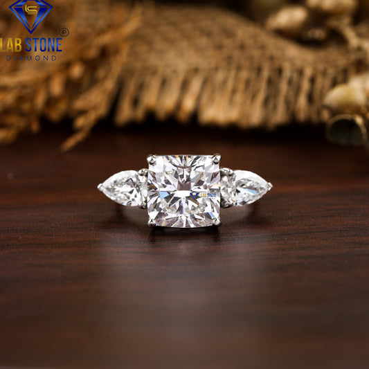 5.55 TDW Cushion & Pear Cut Diamond Three-Stone Ring