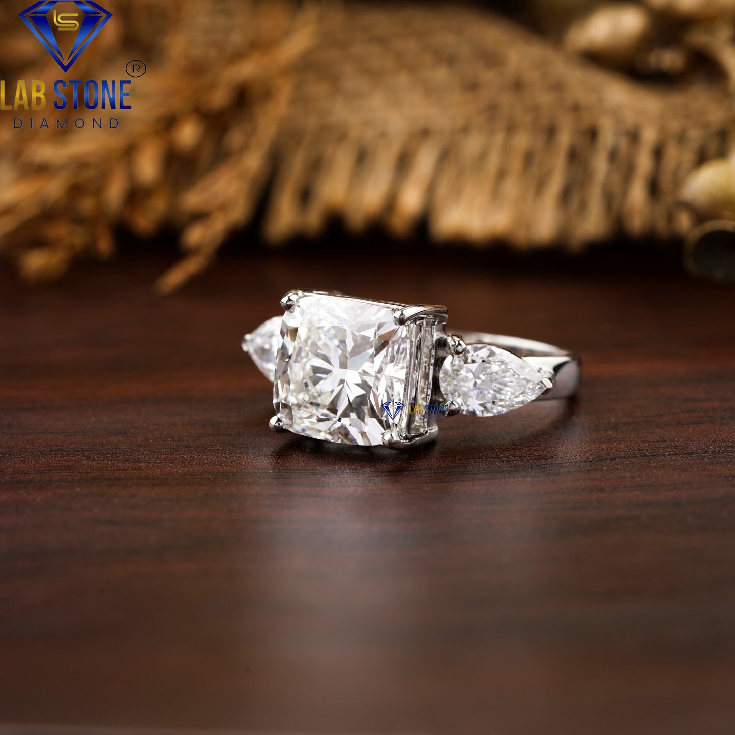 5.55 TDW Cushion & Pear Cut Diamond Three-Stone Ring