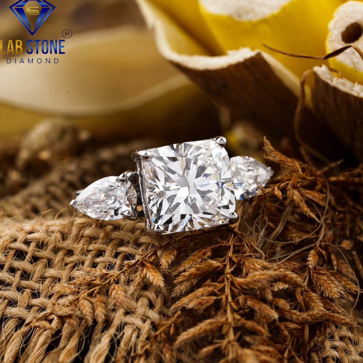 5.55 TDW Cushion & Pear Cut Diamond Three-Stone Ring