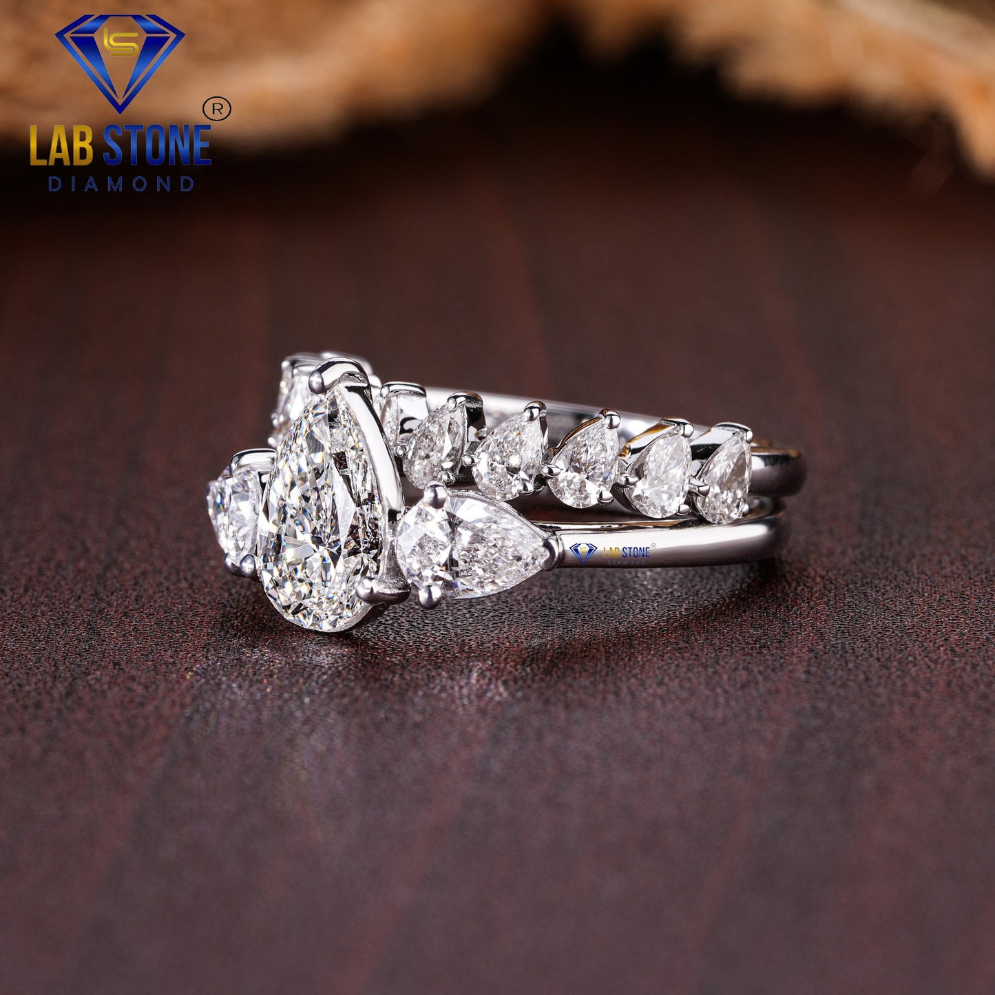 2.58 TDW Pear Cut Women’s Three Stone Diamond Ring with Pear Cut Diamond Band