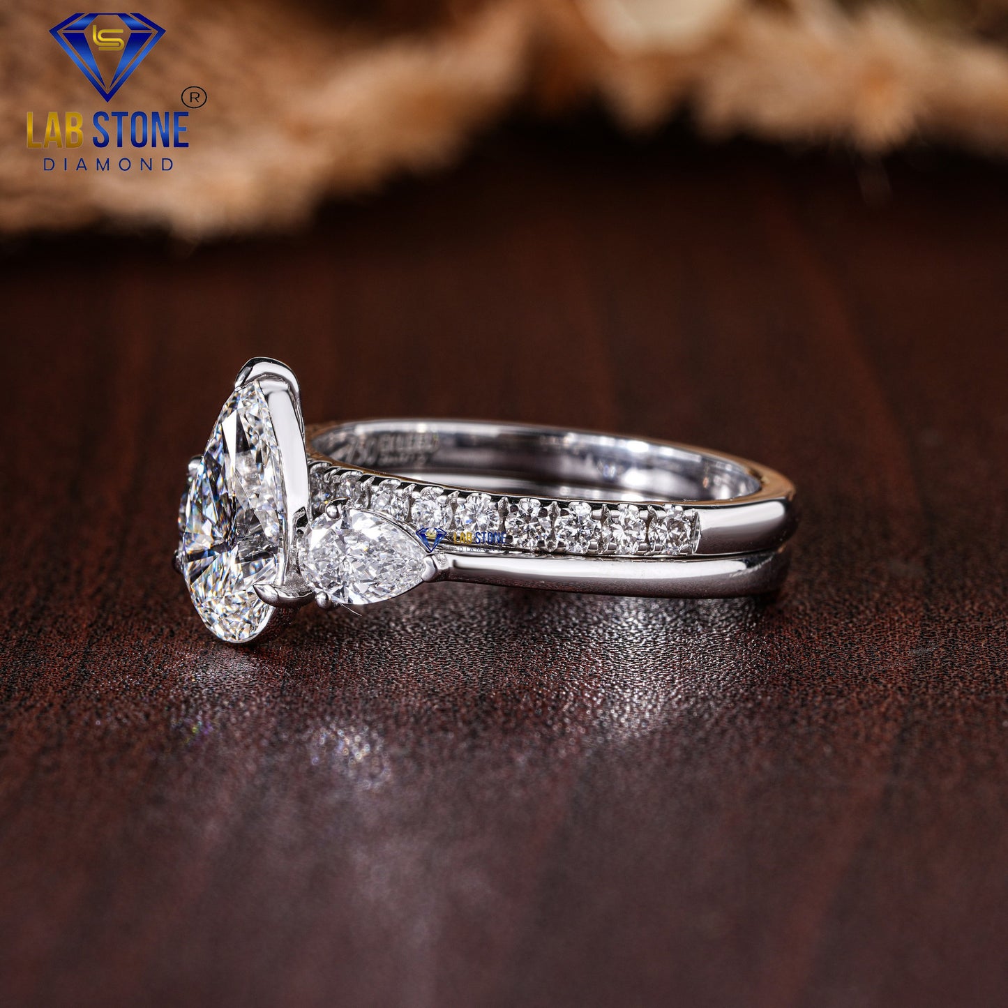 1.90 TDW Pear cut & Round cut Diamond three stone ring with band