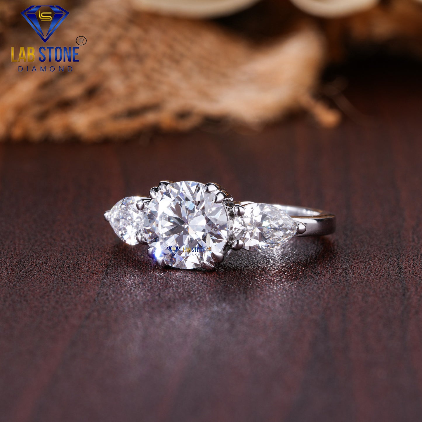 2.46 TDW Round & Pear Cut Diamond Three Stone Ring