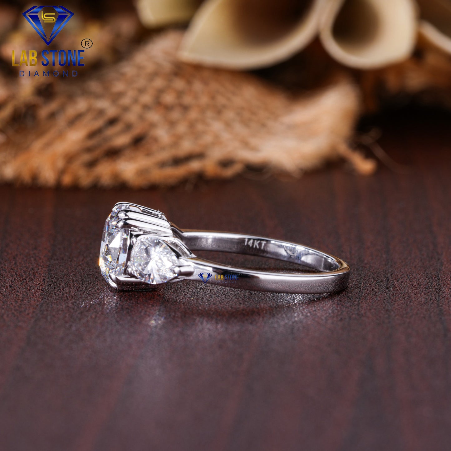 2.46 TDW Round & Pear Cut Diamond Three Stone Ring