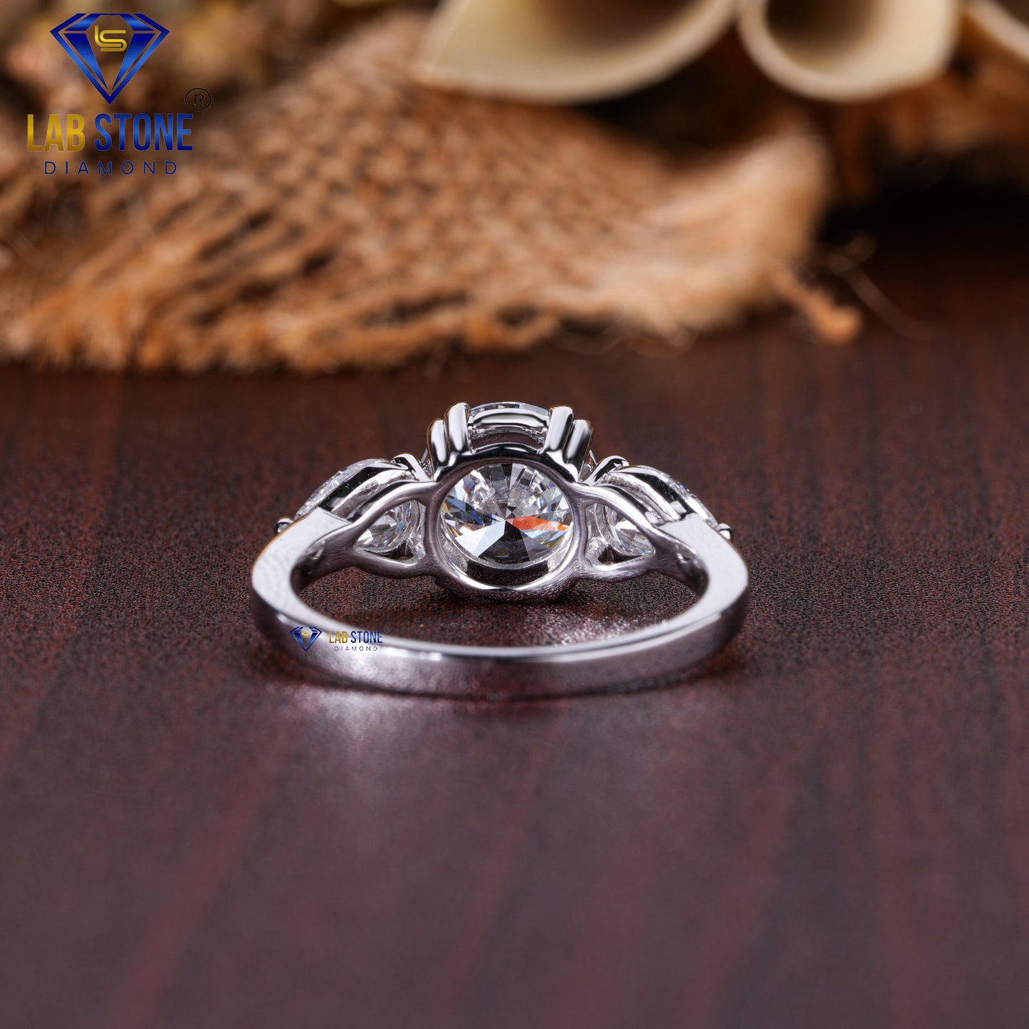 2.46 TDW Round & Pear Cut Diamond Three Stone Ring