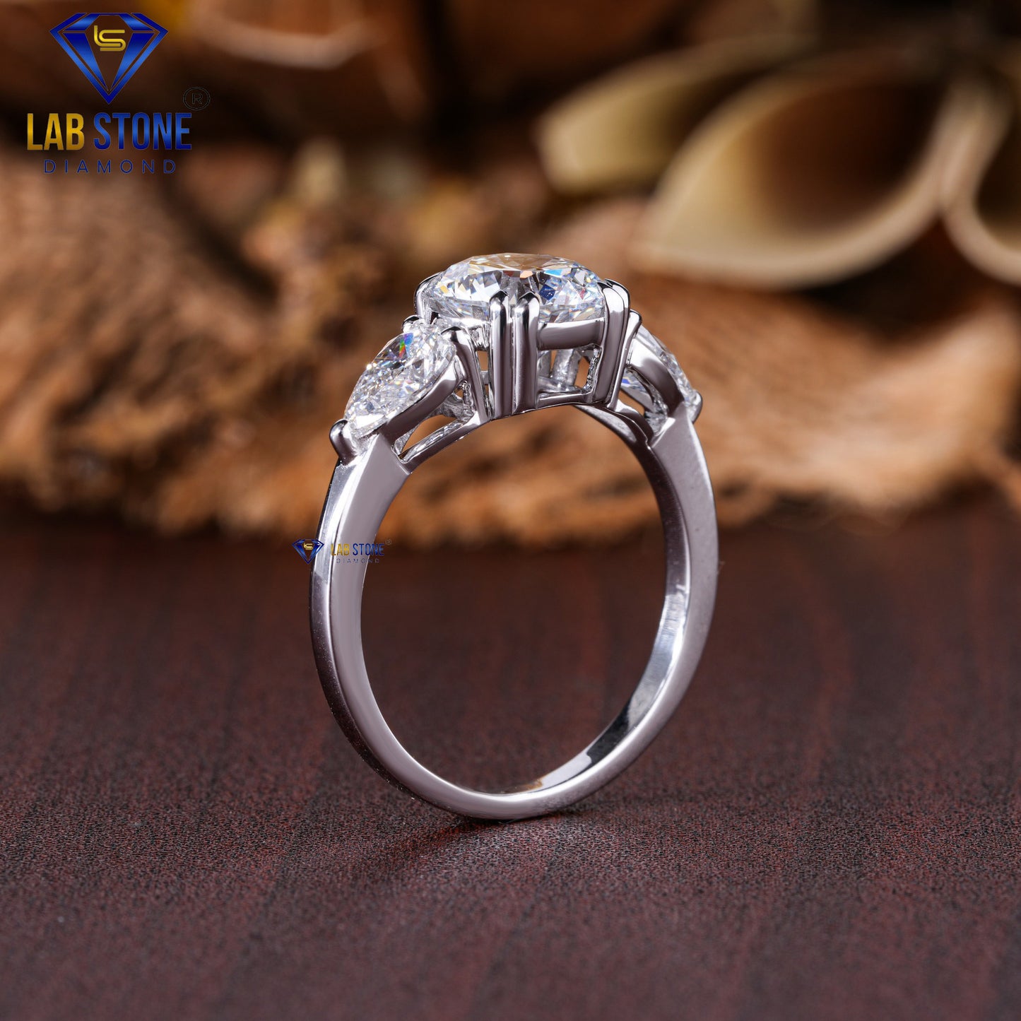 2.46 TDW Round & Pear Cut Diamond Three Stone Ring